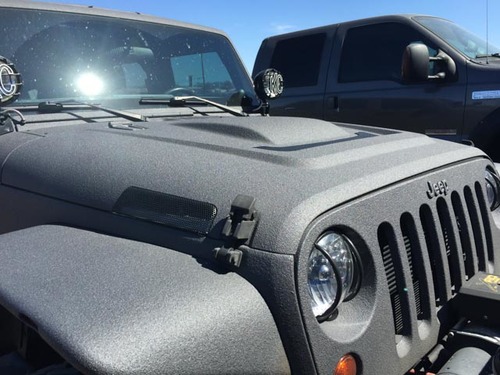 I'm not even sure what this paint job is called, but the entire jeep was like this. Looked like teflon